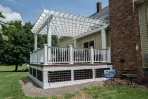 Custom composite deck and white pergola installation by Kaz Home Improvements in Buffalo and Amherst Western New York