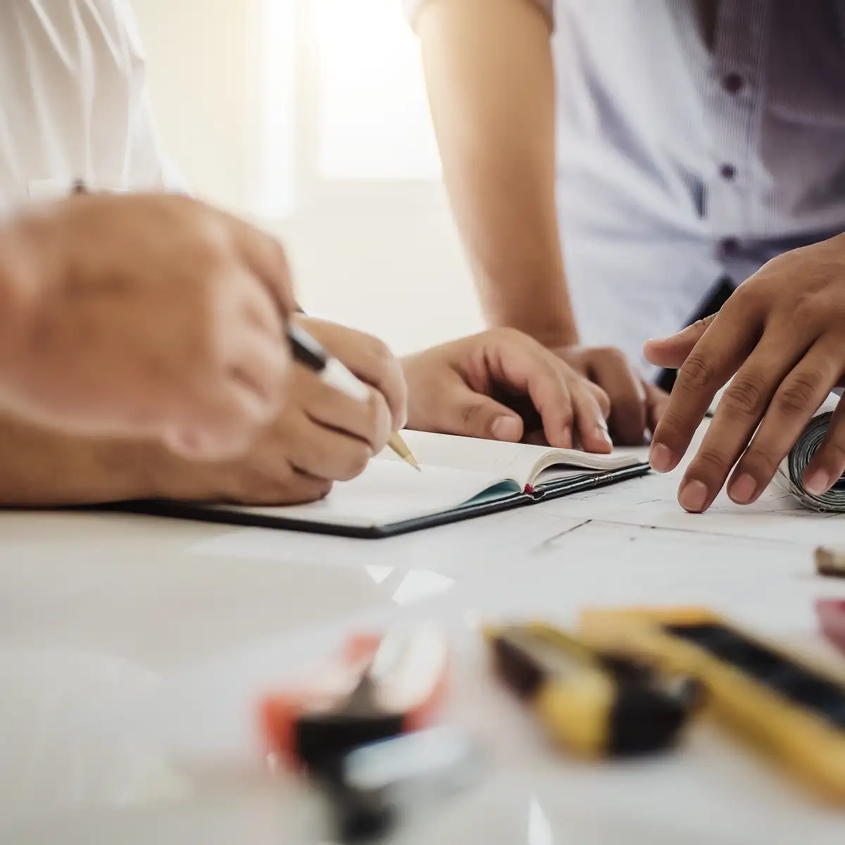 Designers and architects working on a home renovation plan together