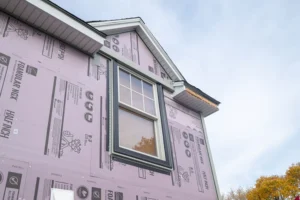 Exterior remodel siding insulation underlay and new replacement window installed