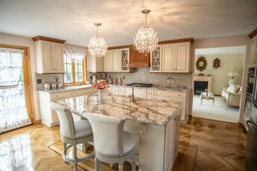 Picture of a high end kitchen renovation with custom cabinets, hardwood flooring, granite counter tops and more