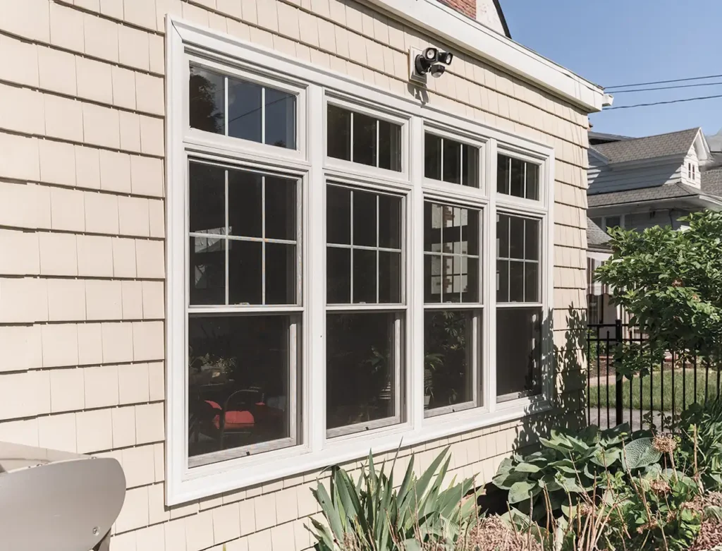 An exterior view of a home addition with new windows Buffalo NY.
