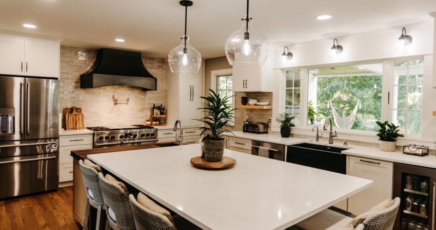 A beautiful kitchen layout with a large center island and granite counter tops