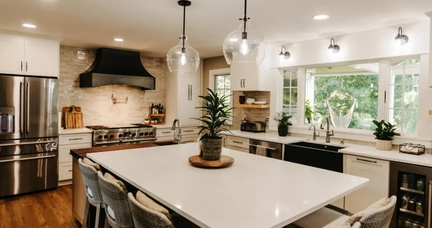 A beautiful open concept kitchen layout with a large center island and granite counter tops