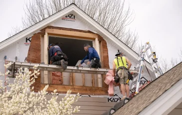 The Kaz exterior crew working on installing a new window