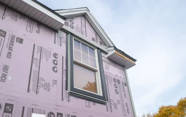 Exterior remodel siding insulation underlay and new replacement window installed