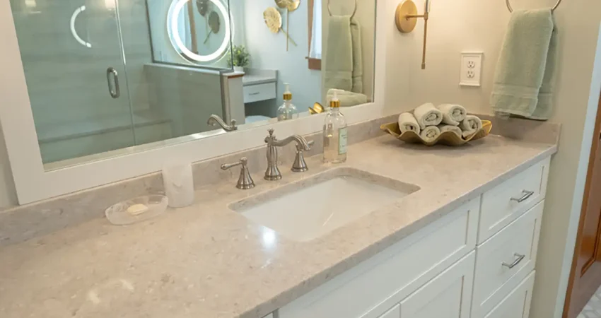 Modern bathroom renovation with granite counter tops and shaker style cabinetry