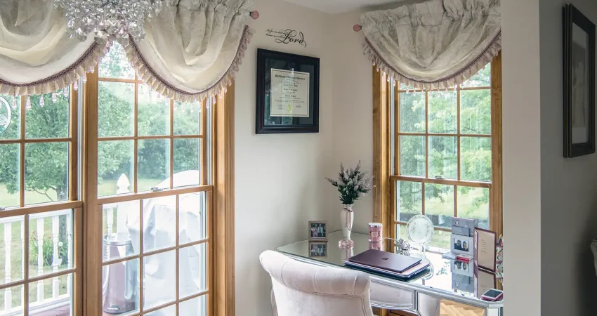 Addition office area featuring parquet style flooring and large casement windows