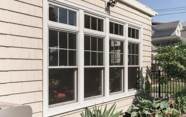 An exterior view of a home addition with new windows