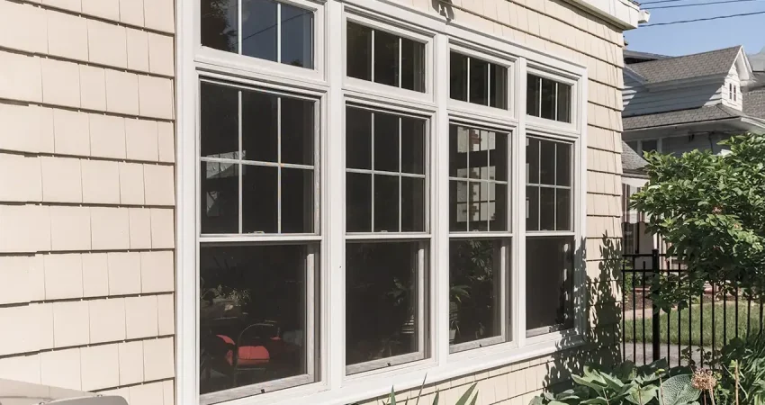 An exterior view of a home addition with new windows