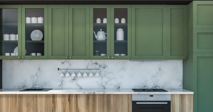 A picture of a modern kitchen with green cabinets