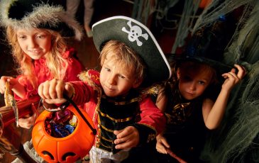 A picture of some children Trick-or-treating
