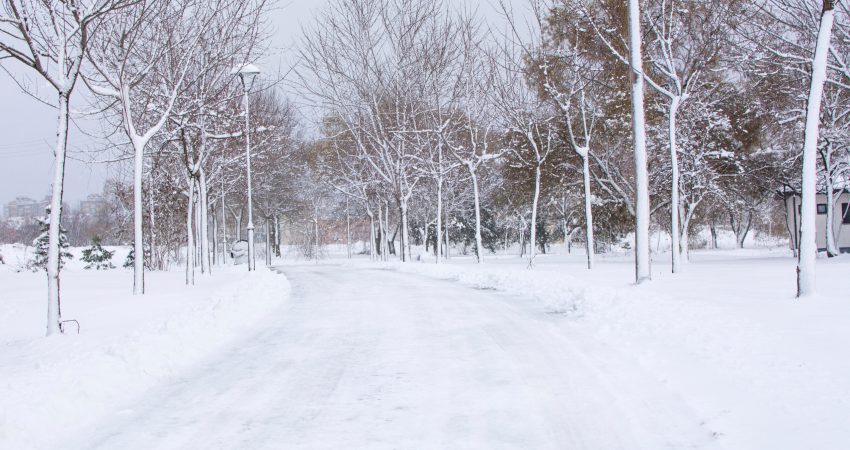park road covered in heavy snow during heavy winter